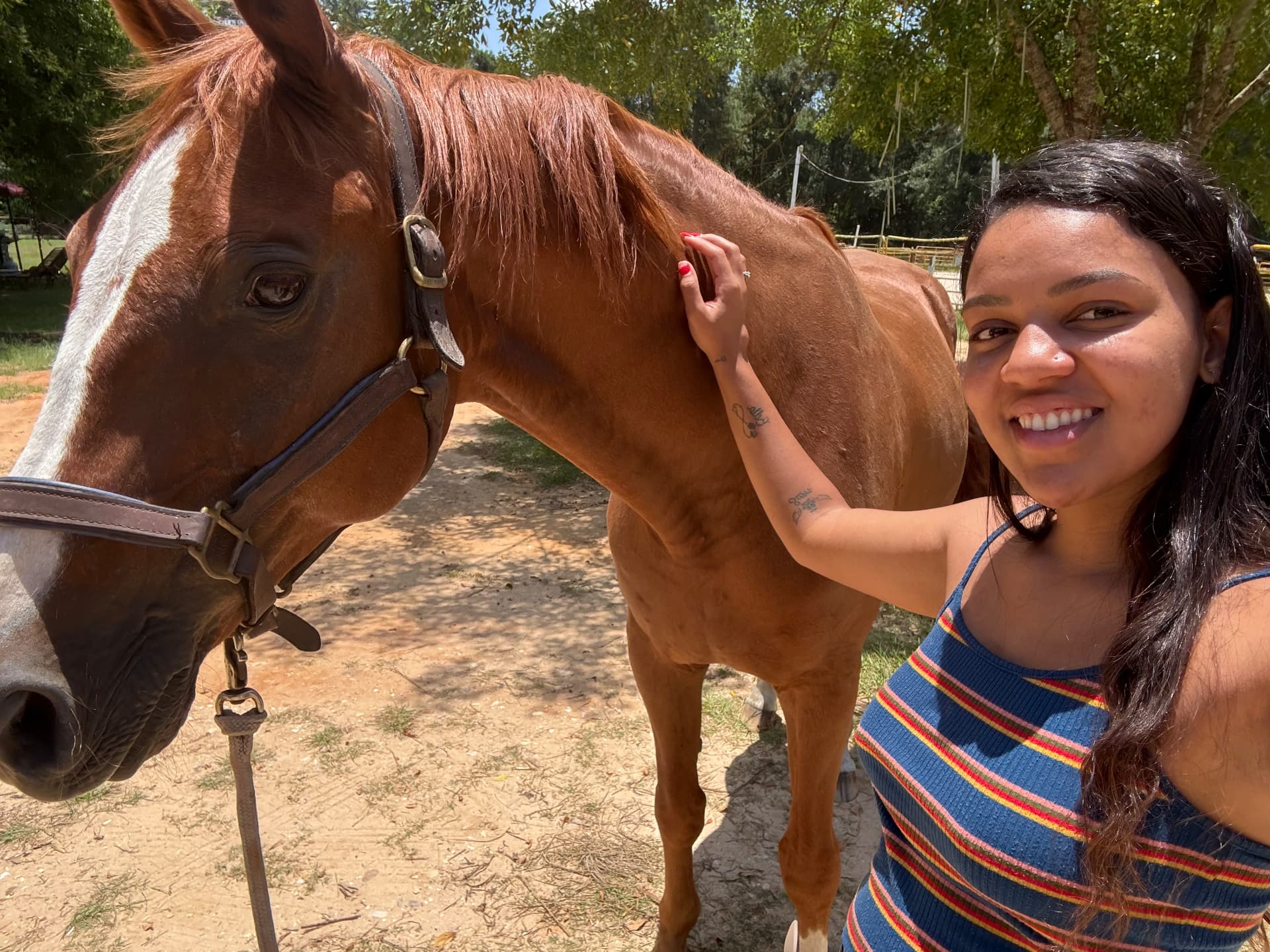 Karolyn standing with a horse